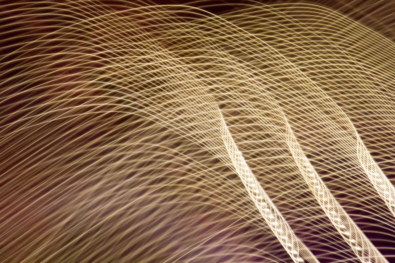 a blurry photo of a person holding a cell phone, a microscopic photo, inspired by Bruce Munro, lyrical abstraction, golden curve structure, long exposure 8 k, golden feathers, ultrafine detail ”