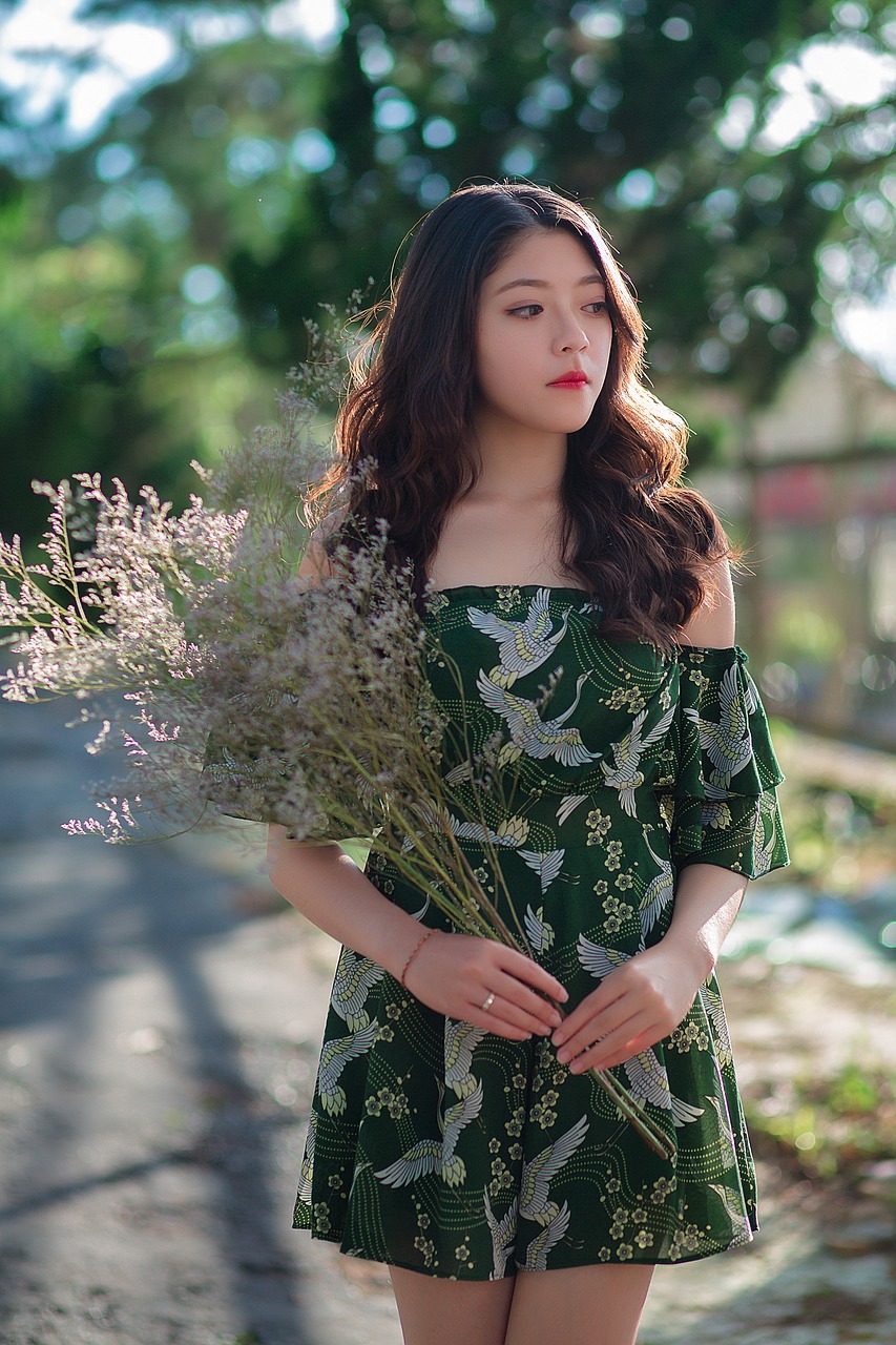 a woman in a green dress holding a bunch of flowers, a picture, by Tan Ting-pho, tumblr, petite girl, patterned clothing, 💣 💥, young wan angel