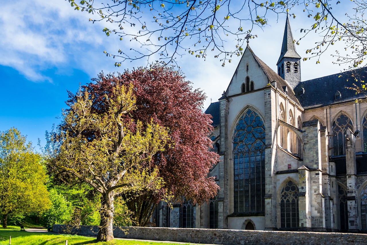 a church with a tree in front of it, a photo, by Hans von Aachen, shutterstock, rennes - le - chateau, warm spring, high detail!!, touring