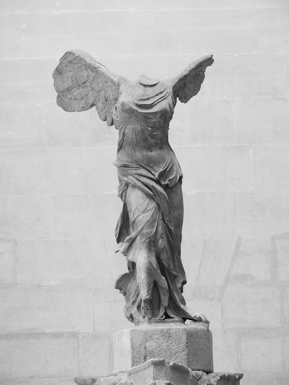 a black and white photo of a statue of an angel, a statue, inspired by Michaelangelo, tumblr, winged victory of samothrace, 90s photo