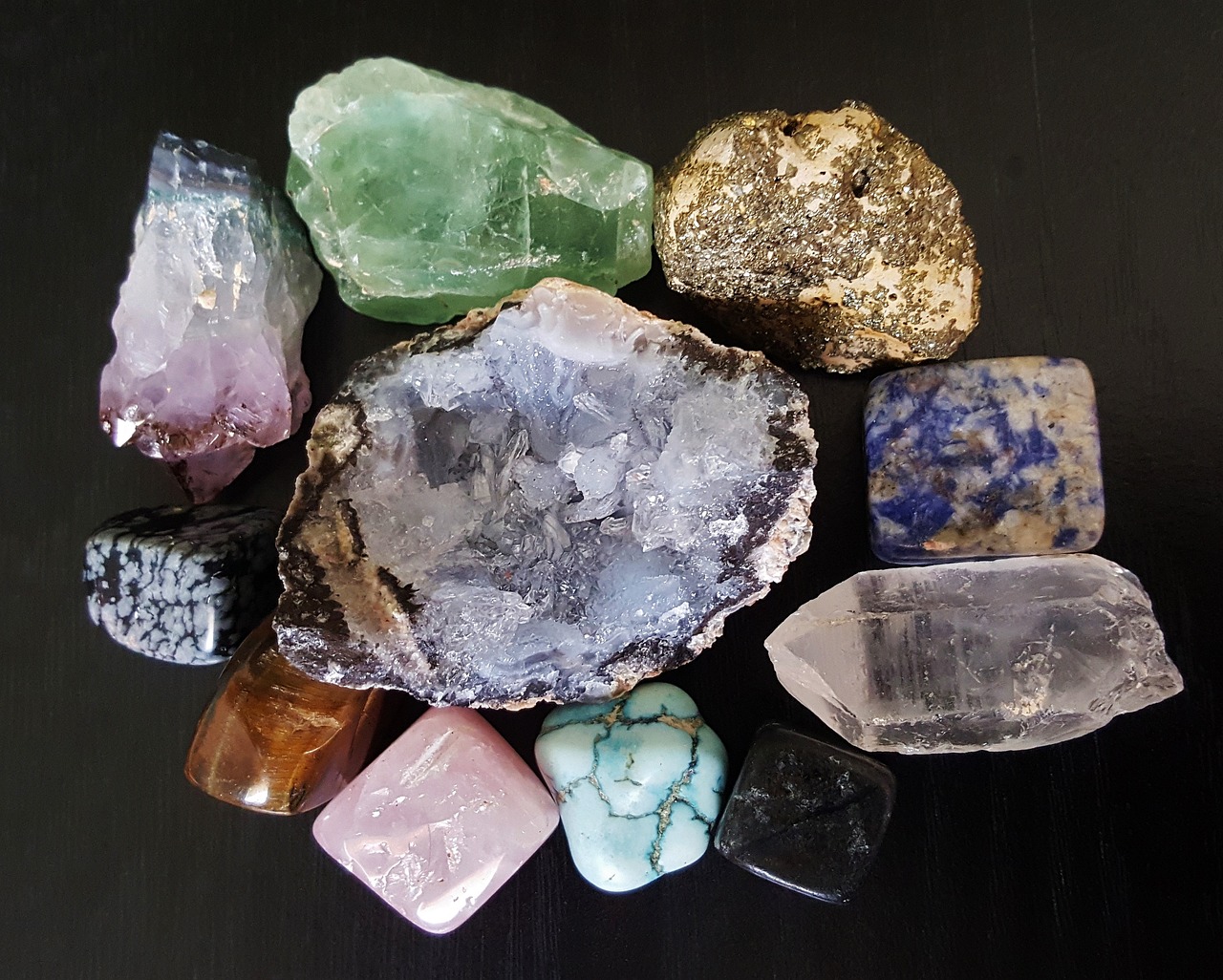 a bunch of rocks sitting on top of a table, by Linda Sutton, pexels, crystal cubism, dazzling gem in the hilt, opal flesh, ashes crystal, various posed