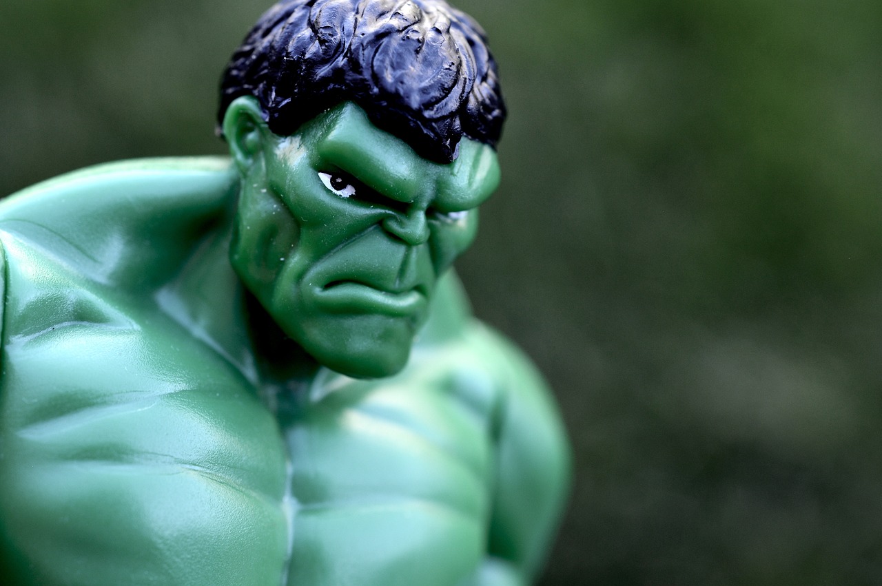 a close up of a toy hulk figure, a macro photograph, pexels, figurativism, the angry, comic book hero, it\'s name is greeny, cool marketing photo