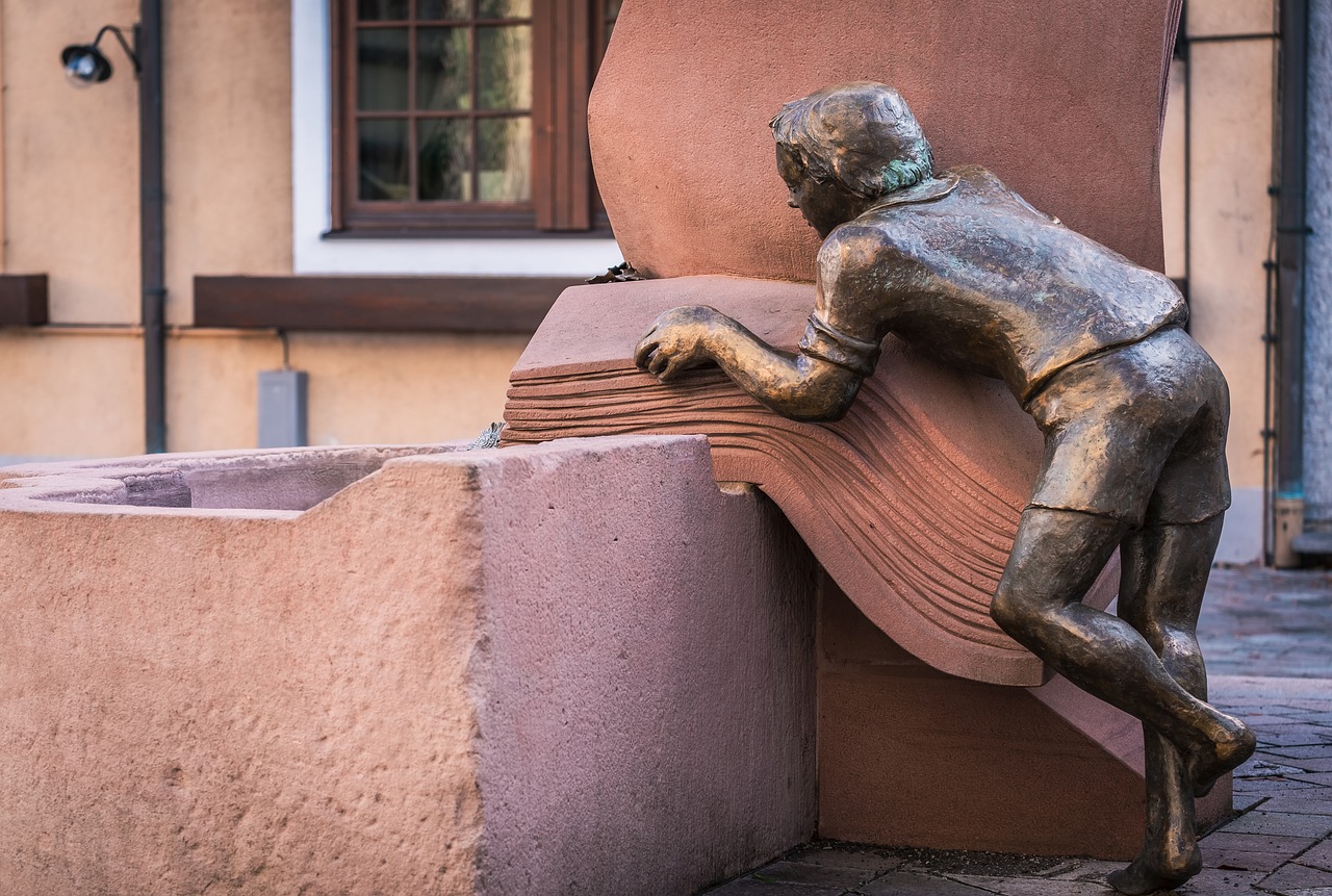 a statue of a man leaning against a wall, a statue, inspired by Heinrich Lefler, figuration libre, ocher details, fountain, ludwig hohlwein, playful composition canon