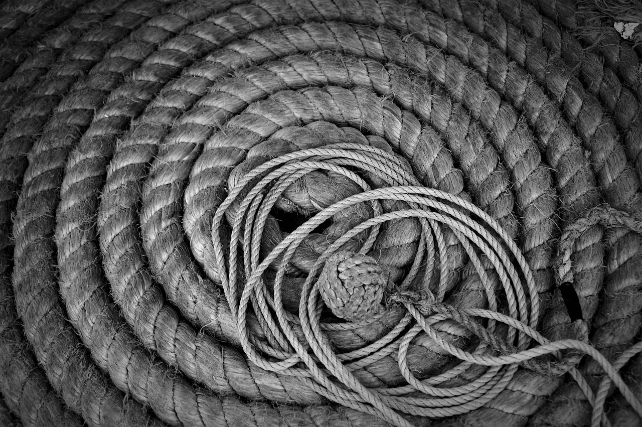 a black and white photo of a rope, inspired by Edward Weston, flickr, 🧒 📸 🎨, ansel!!! adams!!!. intricate, circular, ((still life))