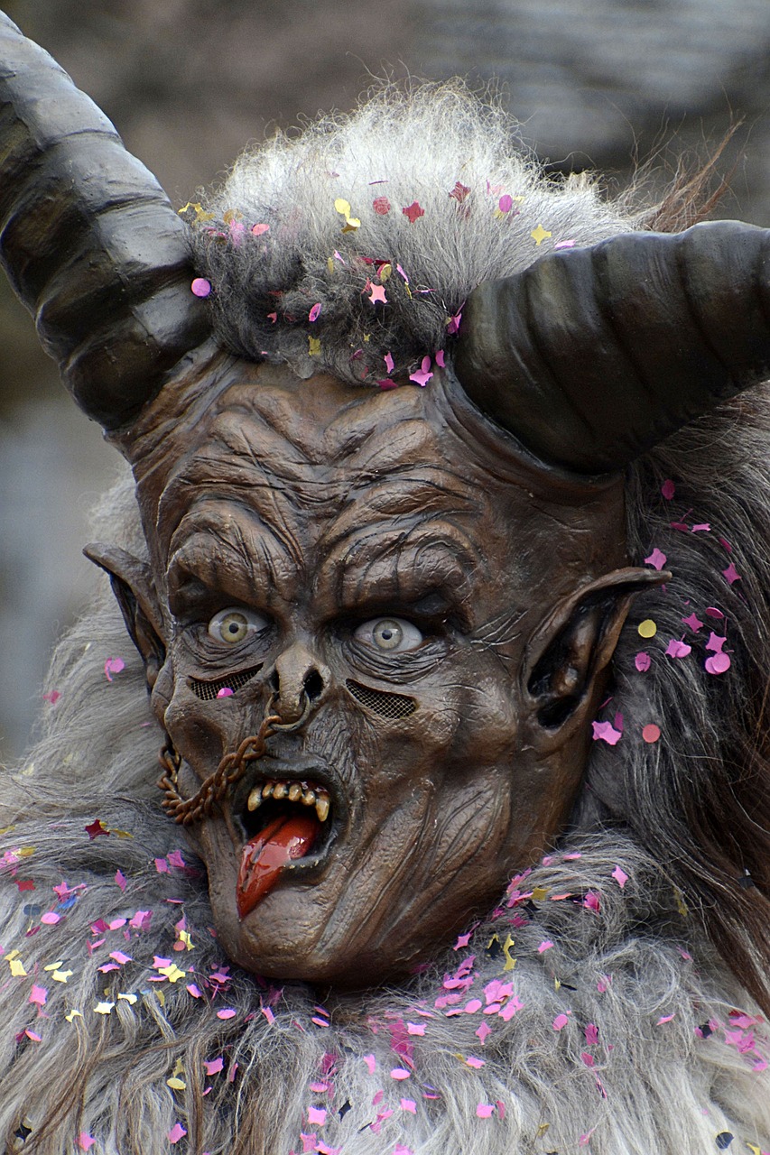 a close up of a mask with flowers on it, flickr, gothic art, portrait of a minotaur, large horns, screeching, carnival