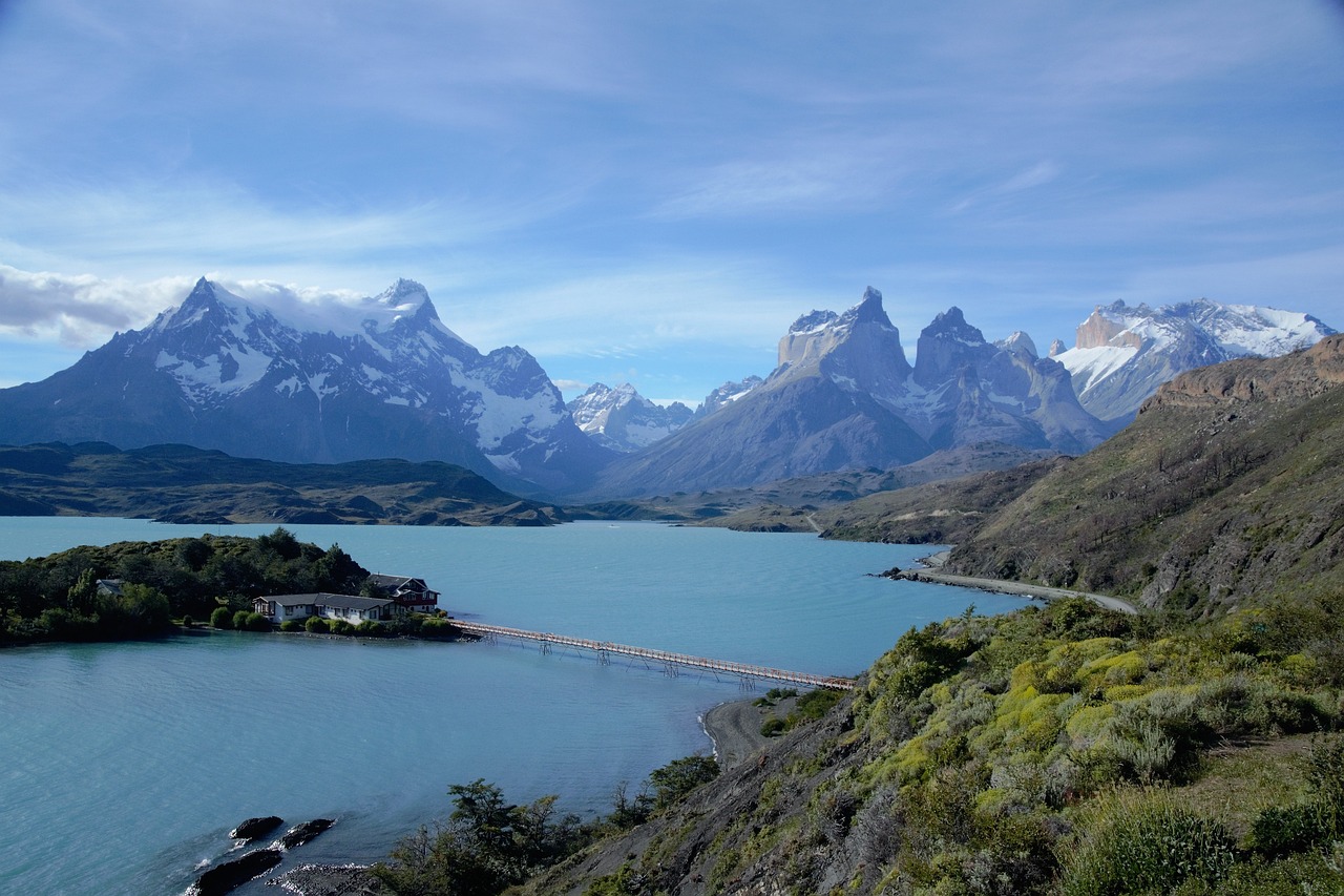 a large body of water surrounded by mountains, a picture, pexels, plein air, patagonian, bridge, stock photo, usa-sep 20