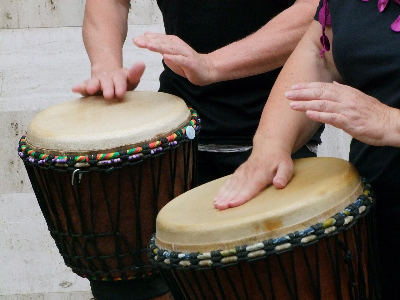 a couple of people that are playing drums, by Juan O'Gorman, enhanced hands, tamborine, choreographed, 15081959 21121991 01012000 4k