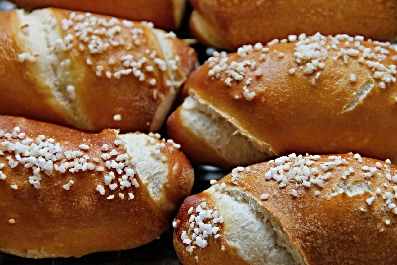 a bunch of bread rolls with sprinkles on them, by Karl Völker, baroque, luscious with sesame seeds, rudolf belarski, 15081959 21121991 01012000 4k, mid portrait