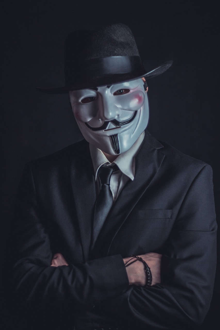 a man in a suit and tie wearing a mask, a colorized photo, unsplash, modernism, bitcoin evil, character with a hat, reaper, mooniq priem