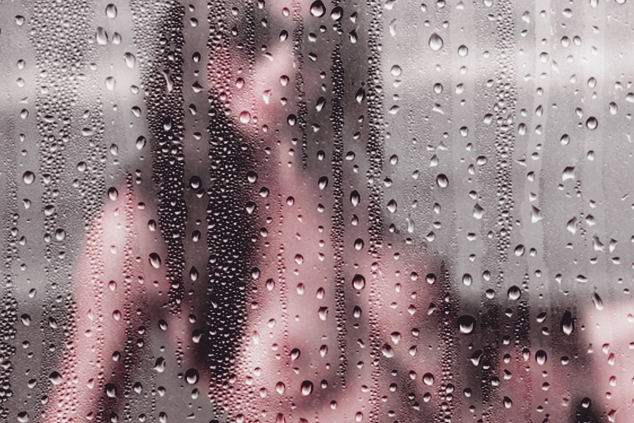 a woman talking on a cell phone in the rain, inspired by Elsa Bleda, faded pink, condensation droplet render, window ( rain ), abstract detail