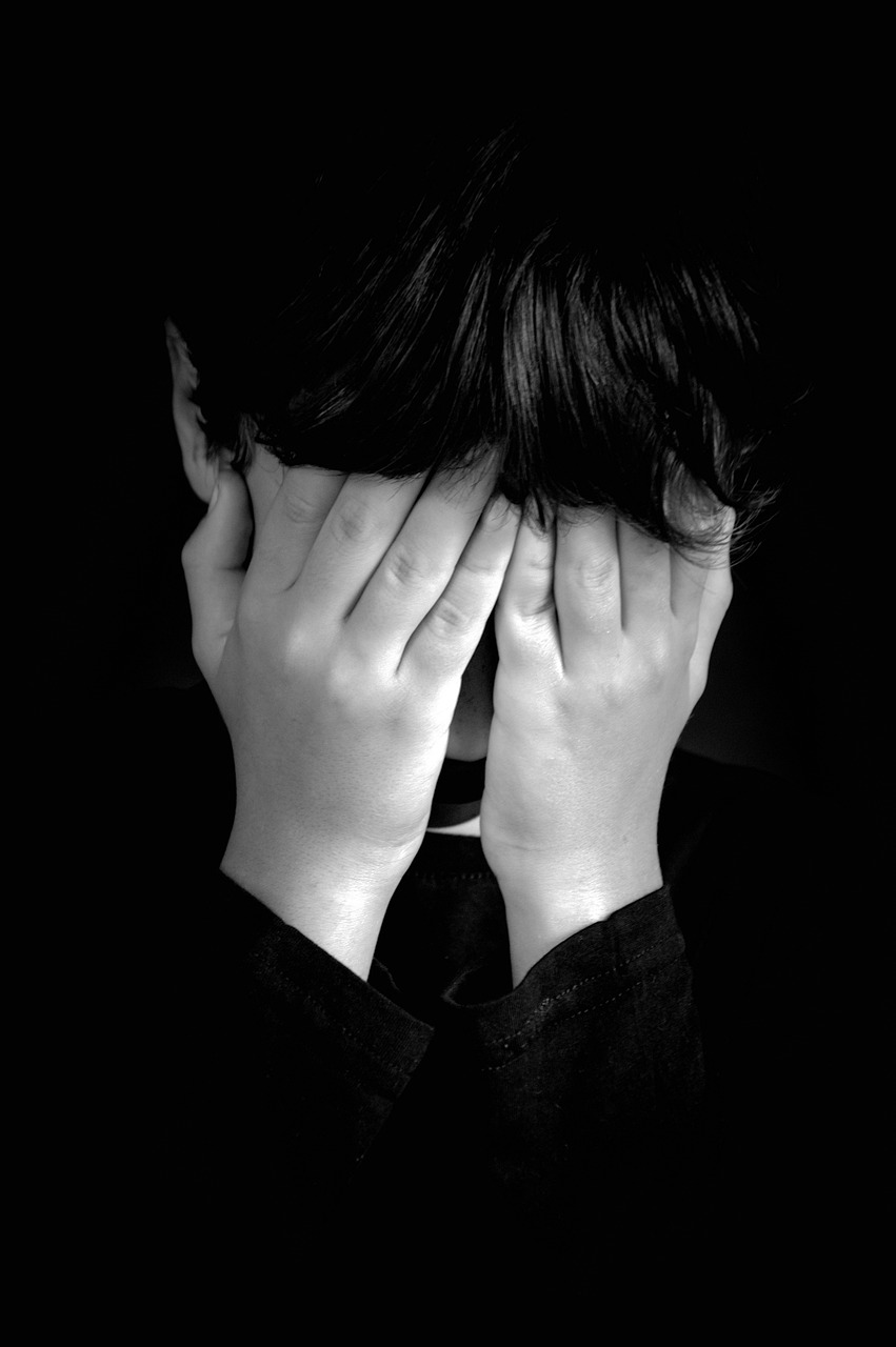a person covering their face with their hands, by Mirko Rački, pixabay, fine art, giga chad crying, black-and-white, back of head, teenage boy