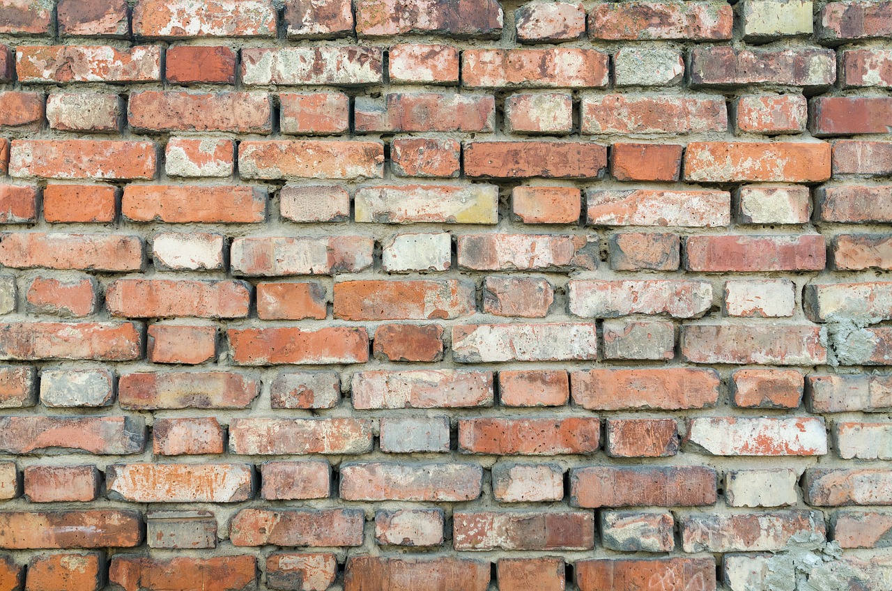 a close up of a red brick wall, a picture, by Jan Kupecký, shutterstock, vintage - w 1 0 2 4, handmade, broken down grey wall, pattern