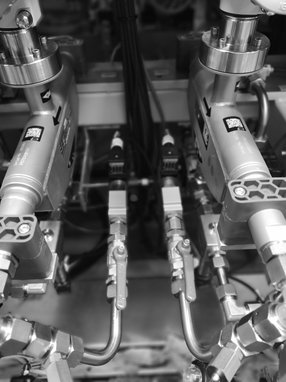 a black and white photo of the inside of a machine, precisionism, robot stand - off, sensors, closeup photograph, trio