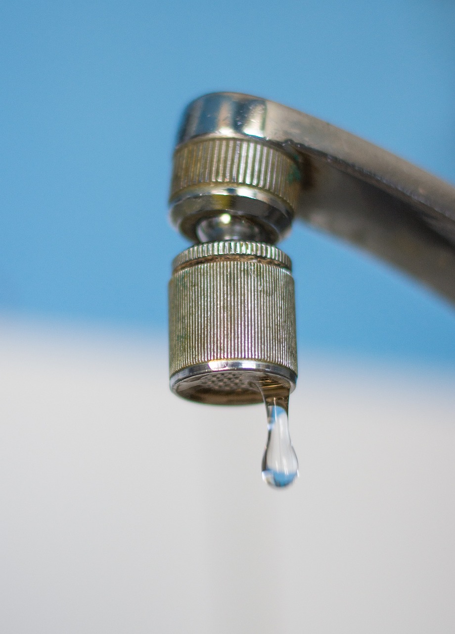 a faucet with a drop of water coming out of it, a photo, closeup photo, portlet photo, hyperdetailed photo, worried