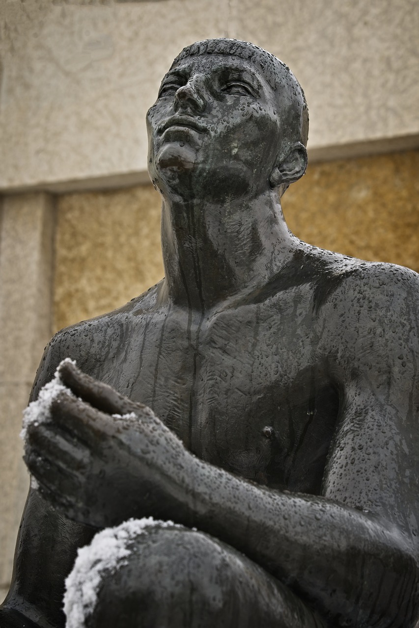 a statue of a man covered in snow, inspired by Sir Jacob Epstein, figuration libre, shirtless :: high detail, portrait of pele, dusting of snow, sigma 85/1.2 portrait