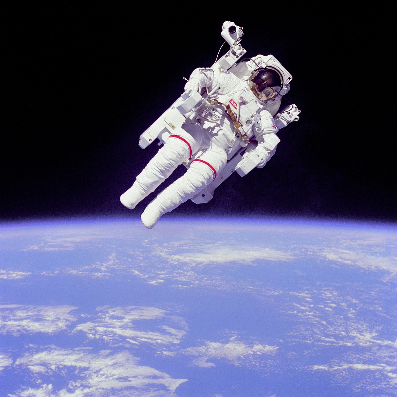 an astronaut floating in the air above the earth, american astronaut, knee, crisp details, mid air shot