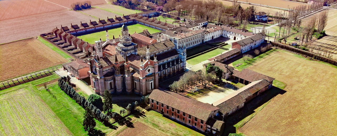 a large castle sitting on top of a lush green field, a photo, by Giorgio De Vincenzi, renaissance, photographic isometric cathedral, lunatic asylum, seen from straight above, high school