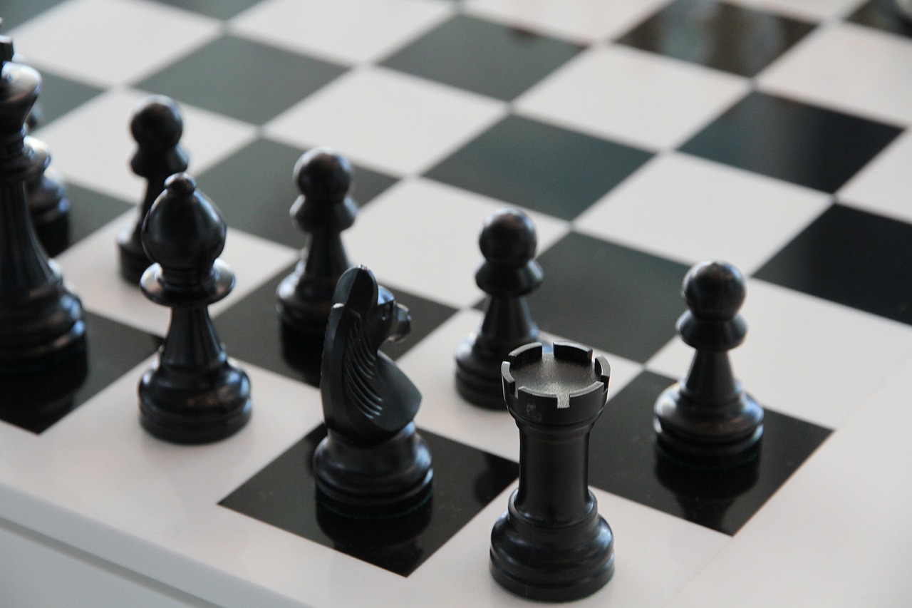 a chess board with black and white chess pieces, black color scheme, zoomed in, chesley, the next generation