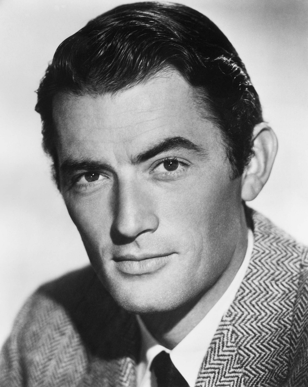 a black and white photo of a man in a suit, a portrait, inspired by Glennray Tutor, well defined jawline, a brightly coloured, actors, a wooden