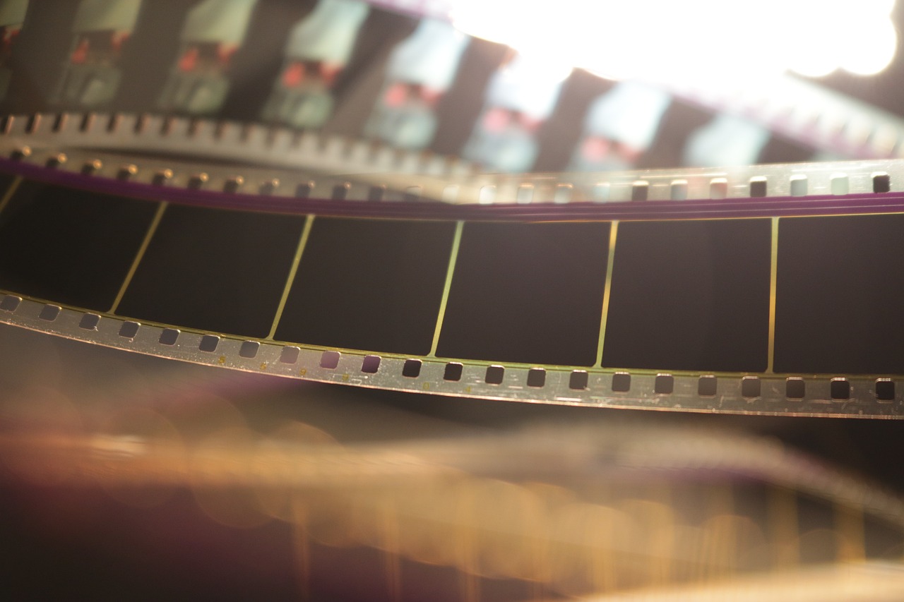 a close up of a film strip, by Anna Haifisch, cinematic ， - h 7 6 8, cinematic lens flare, matrix film color, long cinematic shot