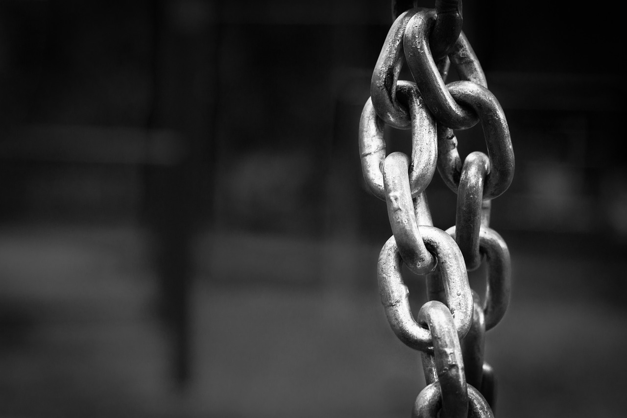 a black and white photo of a chain, by Matija Jama, pixabay, blockchain vault, rust, by greg rutkowski, swings