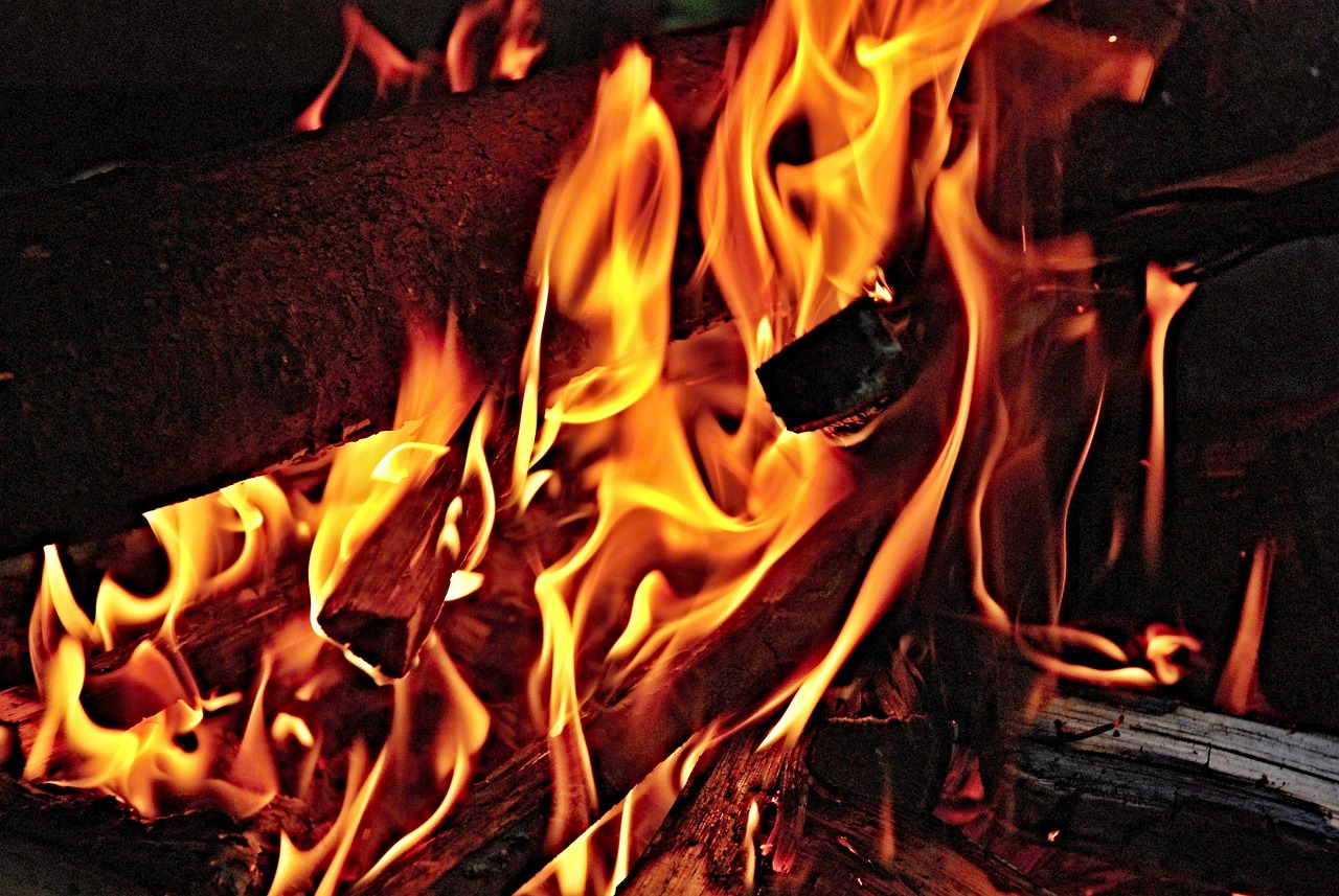 a close up of a fire with flames coming out of it, a picture, by Rodney Joseph Burn, pexels, fine art, a wooden, edited, enhanced photo, 3 4 5 3 1