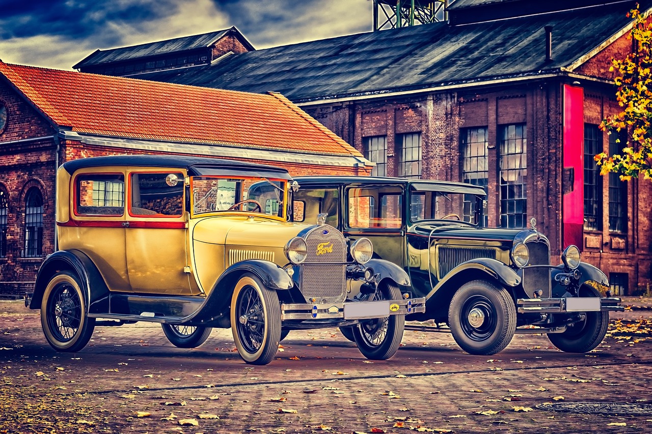 a couple of old cars parked next to each other, trending on pixabay, photorealism, in a factory, golden 1 9 2 0 s, autum, complex composition!!