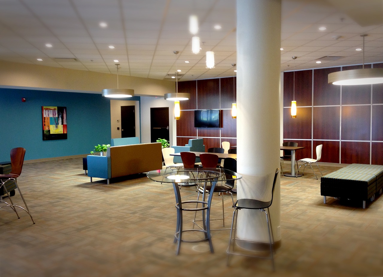 a living room filled with furniture and a flat screen tv, pexels, modernism, hospital lighting, food court, #oc, corporate