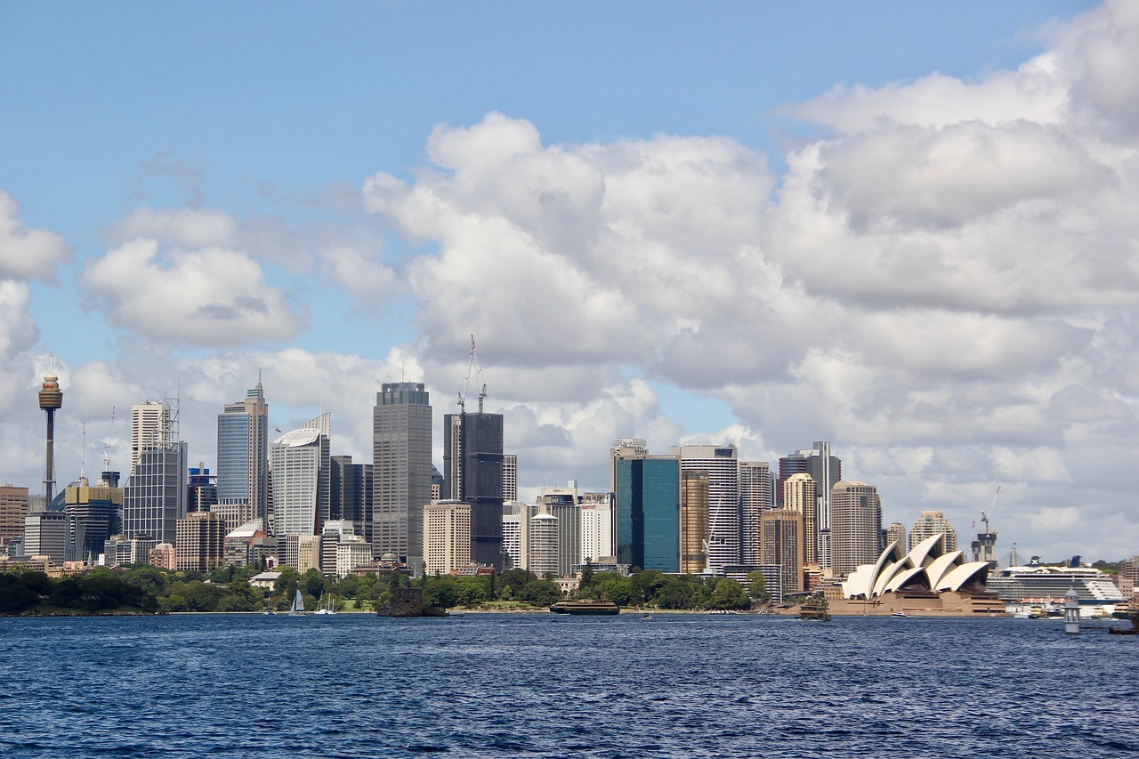 a large body of water with a city in the background, inspired by Sydney Carline, shutterstock, hurufiyya, the photo was taken from a boat, modern high sharpness photo, istockphoto, tourist photo