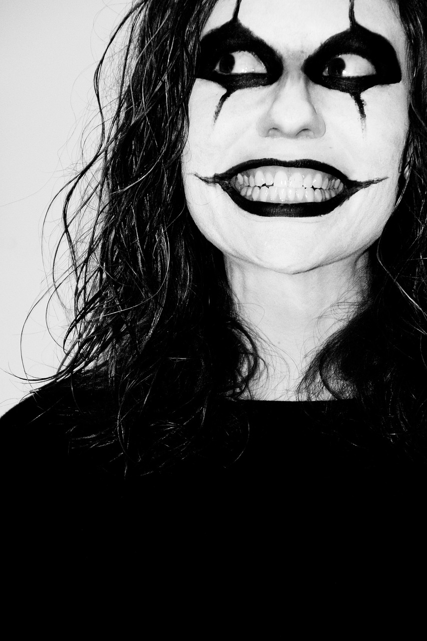 a close up of a person with a face painted like a clown, a black and white photo, by Amelia Peláez, tumblr, antipodeans, big smile white teeth, tommy wiseau, minimalistic art, woman vampire