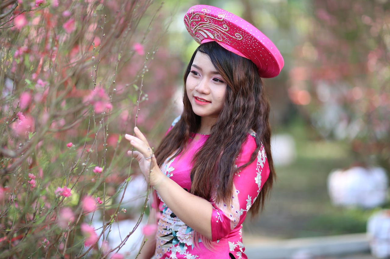 a woman in a pink dress and a pink hat, a picture, inspired by Jin Nong, cute photo, vietnamese woman, 15081959 21121991 01012000 4k, wearing floral chiton