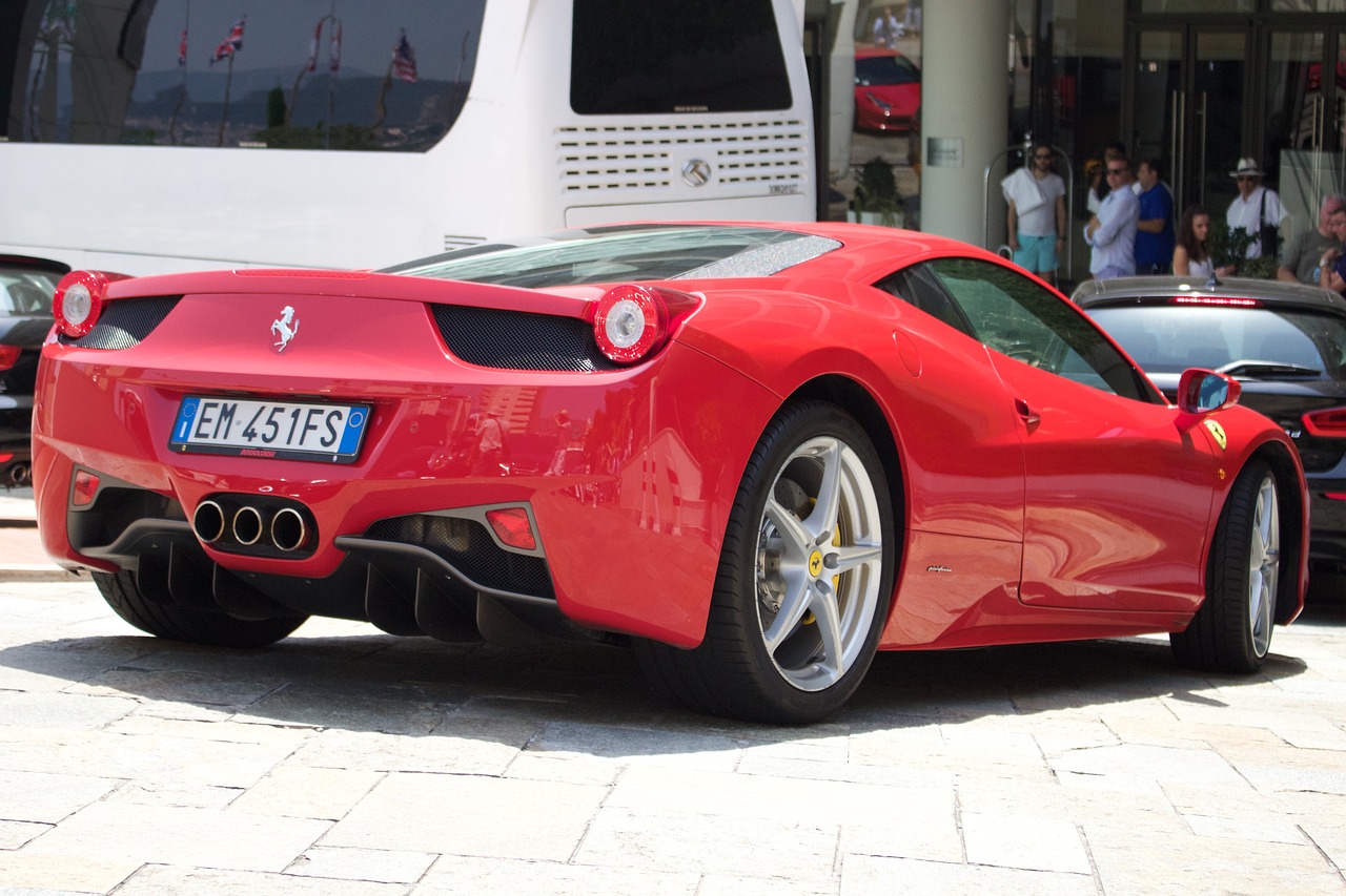 a red sports car parked in front of a bus, inspired by Bernardo Cavallino, pixabay, renaissance, ferrari 458, long shot from back, cannes, 2012
