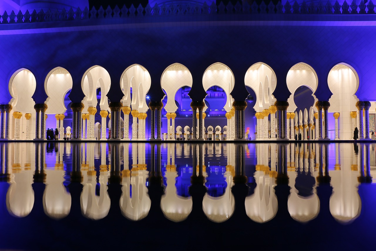 a reflection of arches in a pool of water, by Sheikh Hamdullah, arabian night, gaudy, 2 0 2 2 photo