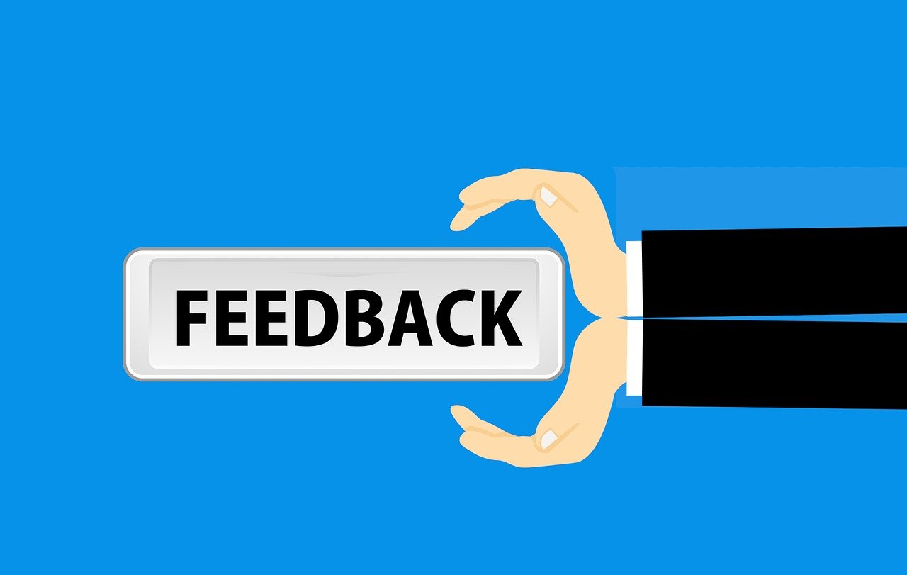 a hand holding a sign that says feedback, a digital rendering, shutterstock, blue background colour, wikihow illustration, his back is turned, very accurate photo