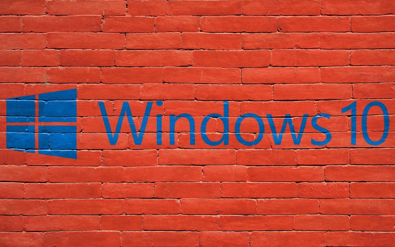 a brick wall with the word windows 10 painted on it, a screenshot, pixabay, blue and red color scheme, poland, sliding glass windows, in red background
