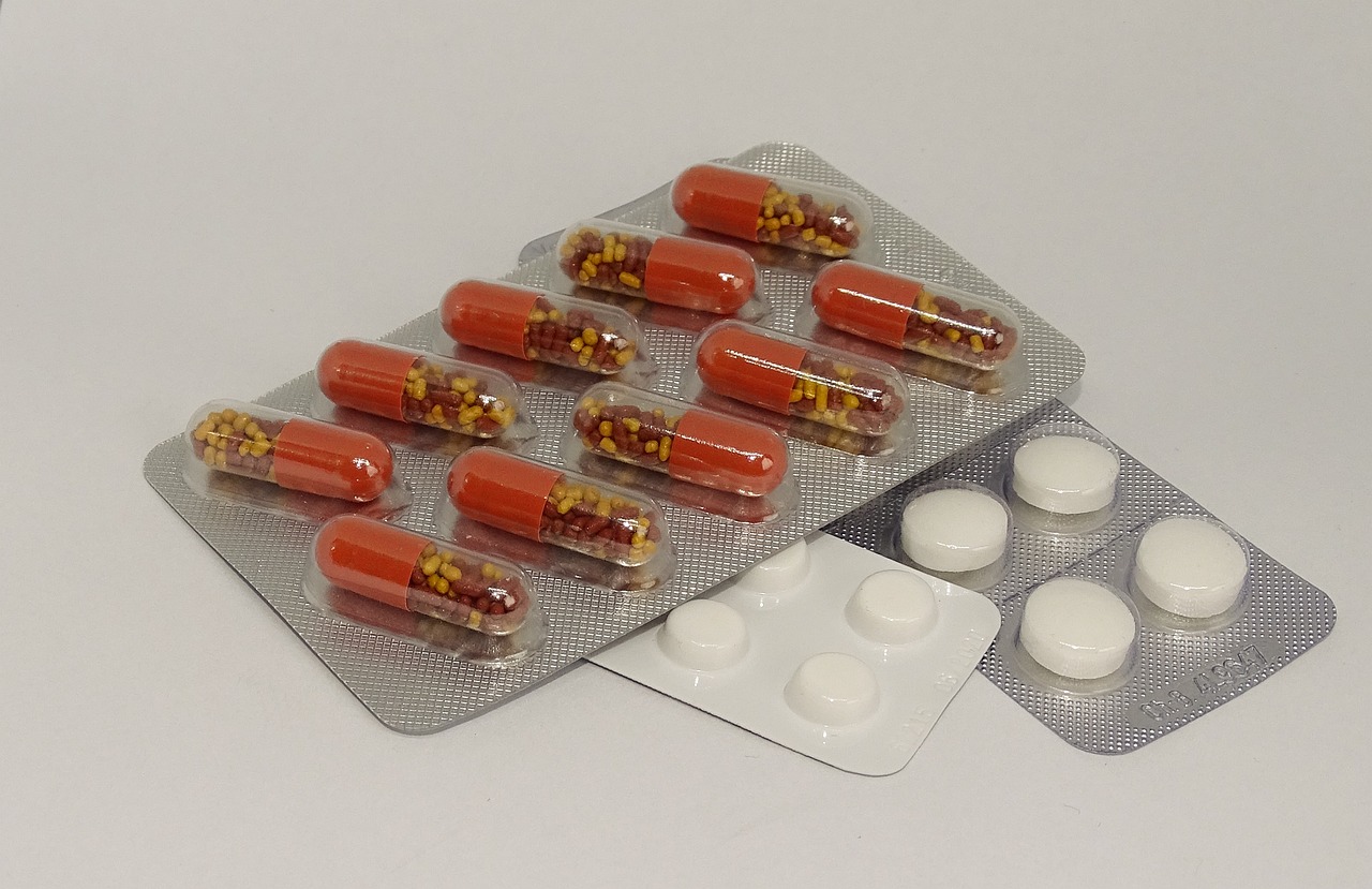 a bunch of pills sitting on top of a blister pack, a picture, antipodeans, without duplication, tanks, facing right, garnishment