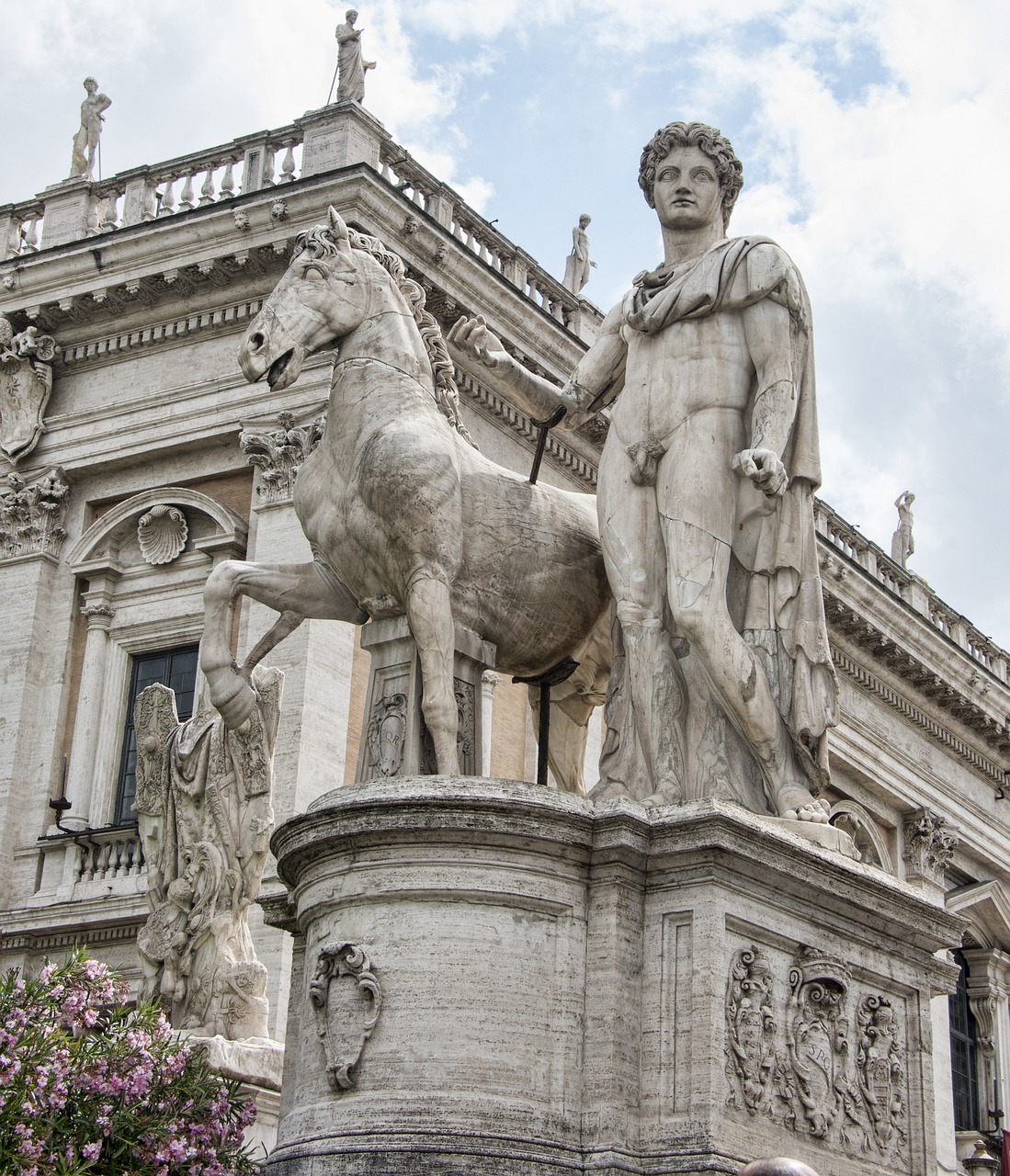 a statue of a man and a horse in front of a building, a statue, inspired by Caesar van Everdingen, shutterstock, neoclassicism, colosseo, high res photo, elaborate details, statue of a woman