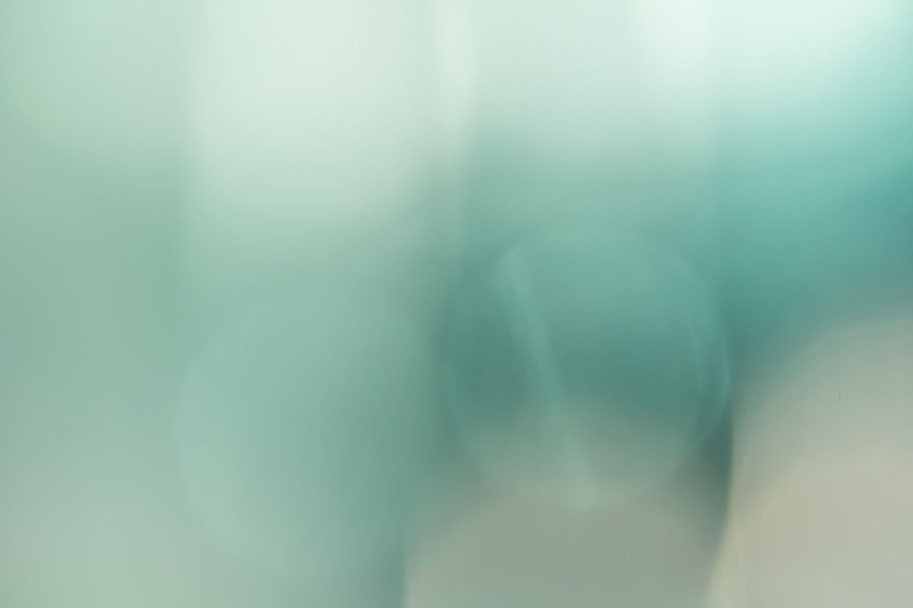 a close up of a toothbrush with a blurry background, a picture, inspired by Elsa Bleda, minimalism, gradient pastel green, cyan fog, f1.8 bokeh, 1 0 2 4 farben abstract