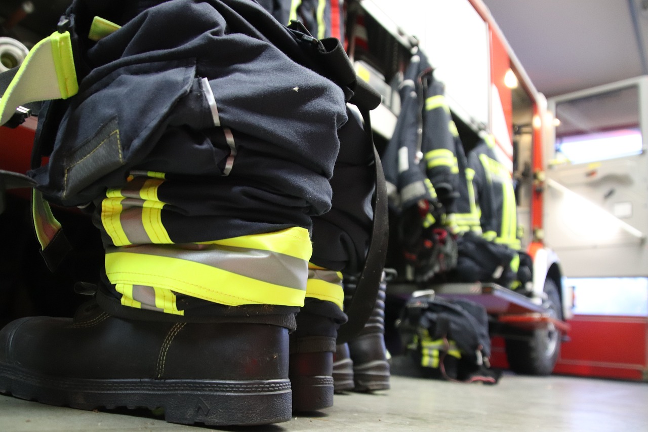 a close up of a pair of firemen's boots, by Christen Dalsgaard, shutterstock, group photo, working clothes, a wide shot, tocchini