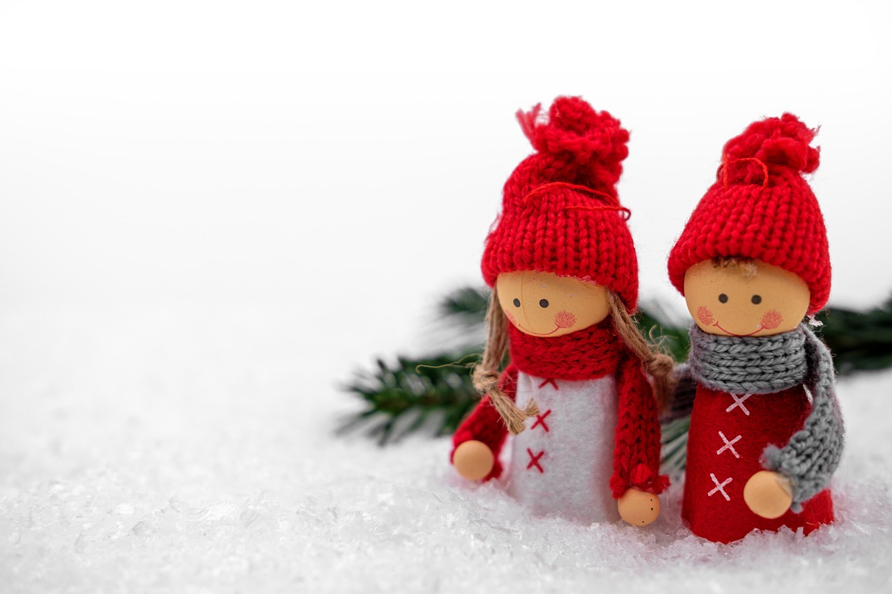 a couple of dolls that are standing in the snow, by Marie Angel, trending on pixabay, reds, tiny sticks, holiday vibe, background is white