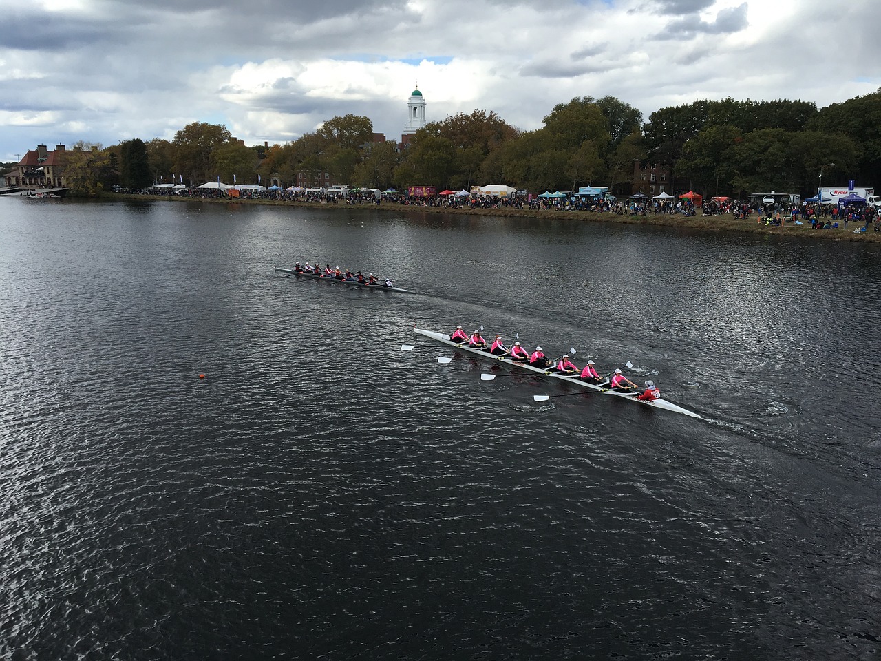 a group of people rowing across a body of water, a photo, by Whitney Sherman, reddit, pink, [32k hd]^10, boston, october