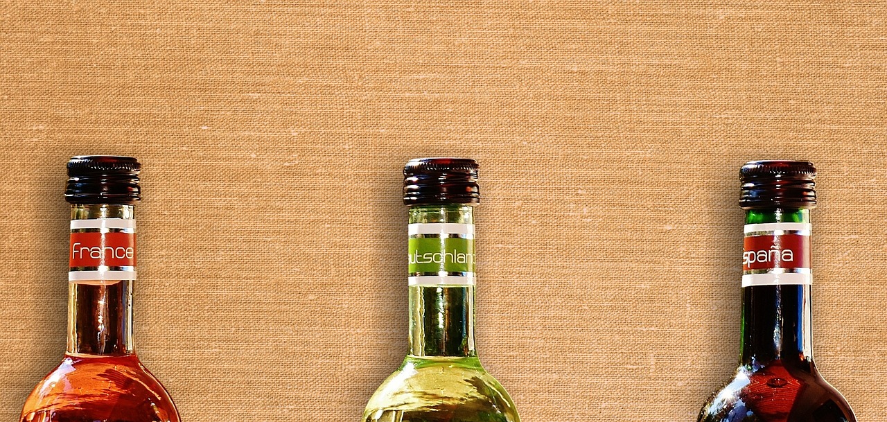 three bottles of alcohol sitting next to each other, by Joseph Raphael, tachisme, canvas texture, mobile wallpaper, miniature product photo, white wine bottle