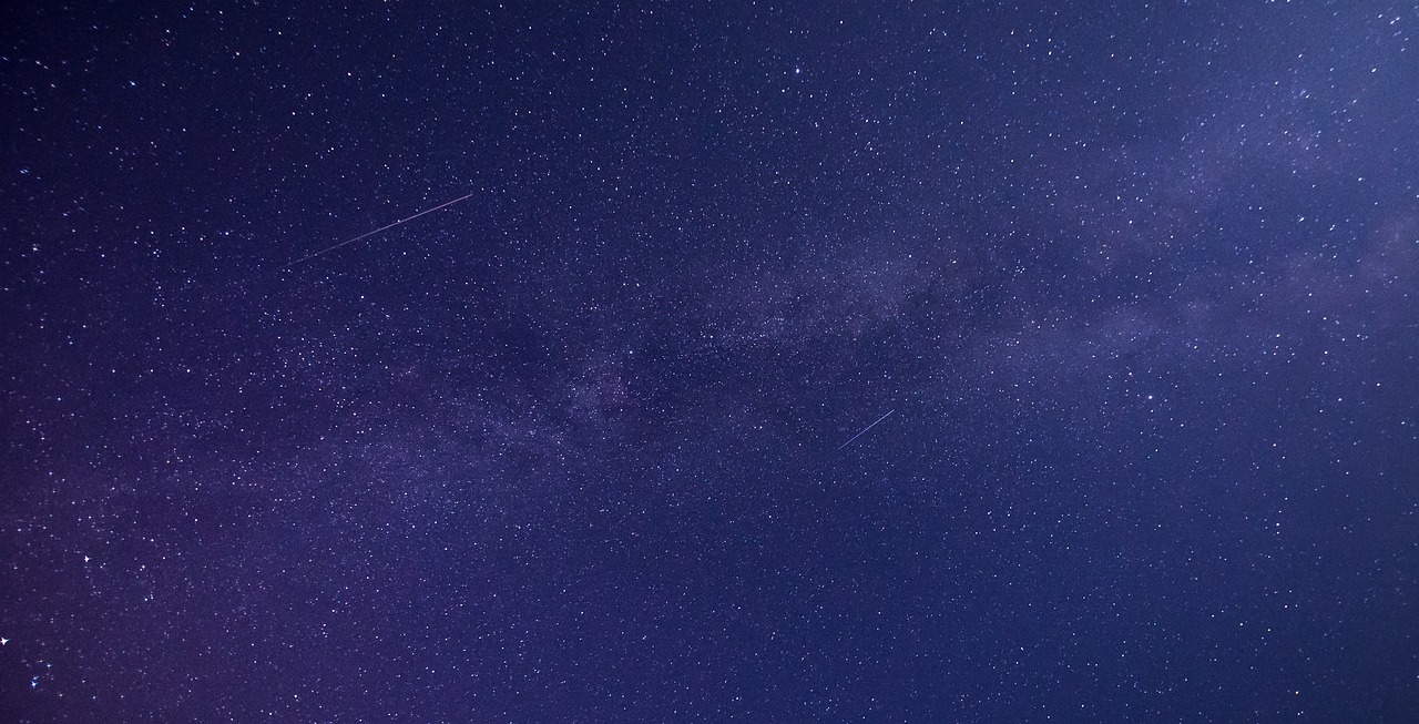 there is a plane that is flying in the sky, by Niko Henrichon, pexels, space art, perseides meteor shower, banner, detailed zoom photo, the milk way
