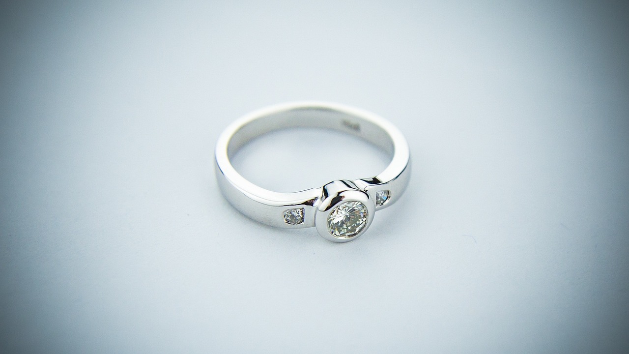 a close up of a diamond ring on a table, flickr, minimalism, ultra detailed”, coloured, but very good looking”