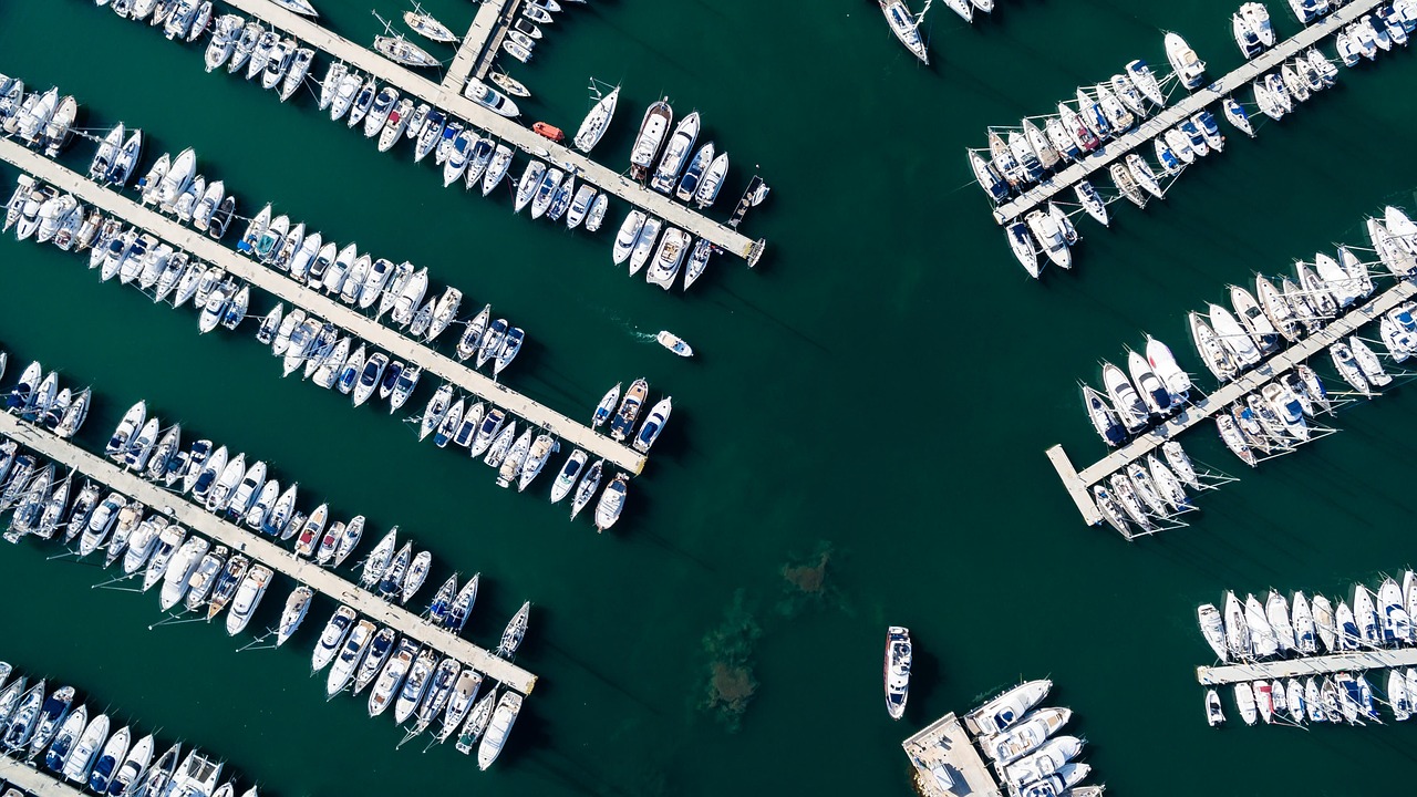 a number of boats in a large body of water, pexels contest winner, top down photo at 45 degrees, docked at harbor, istock, complex and detailed