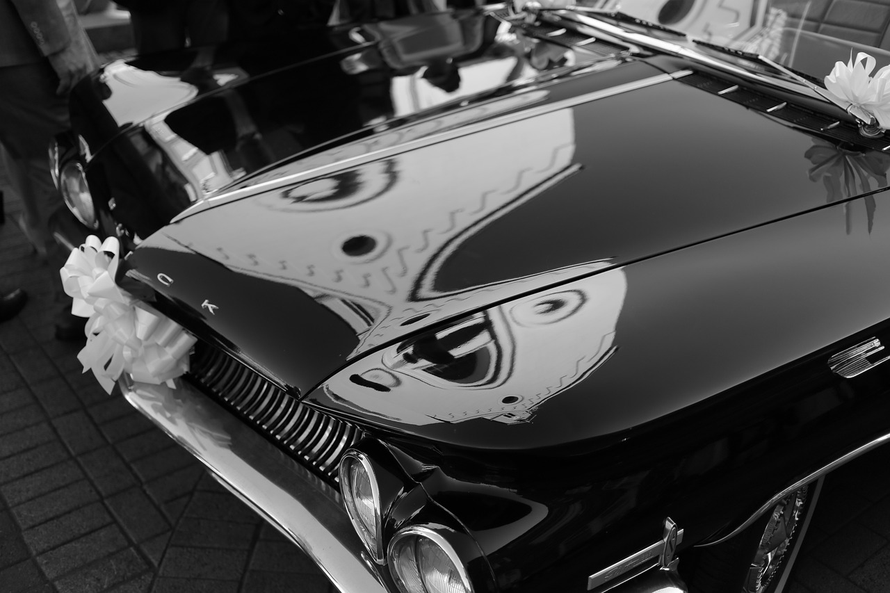 a black and white photo of a classic car, a black and white photo, by Micha Klein, flickr, shiny glossy mirror reflections, mercury, phone wallpaper, fins