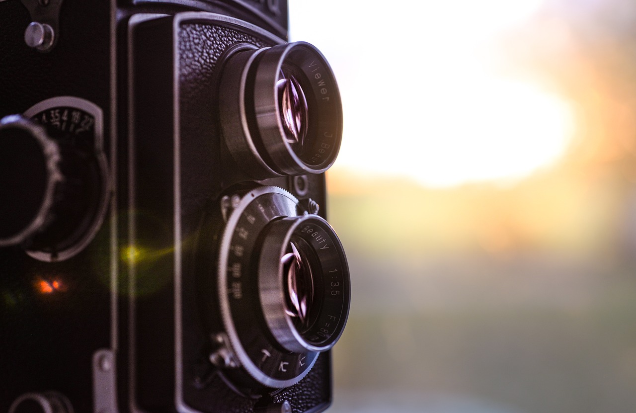 a close up of a camera with the sun in the background, art photography, rolleiflex tlr, cameras lenses, bokeh dof sky, medium close-up shot