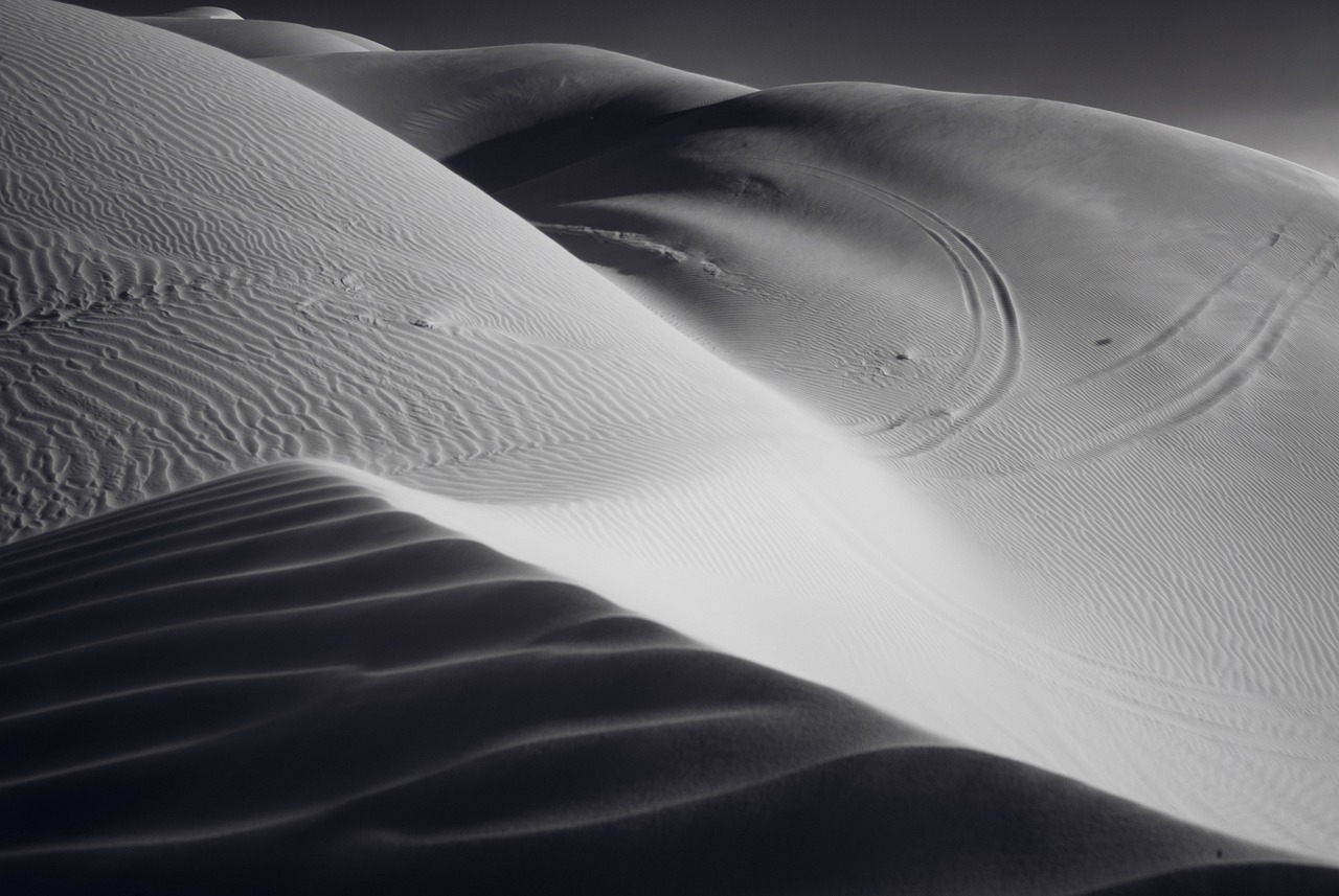 a black and white photo of sand dunes, inspired by Edward Weston, featured on zbrush central, infinity hieroglyph waves, smooth details, arabic, rick dai