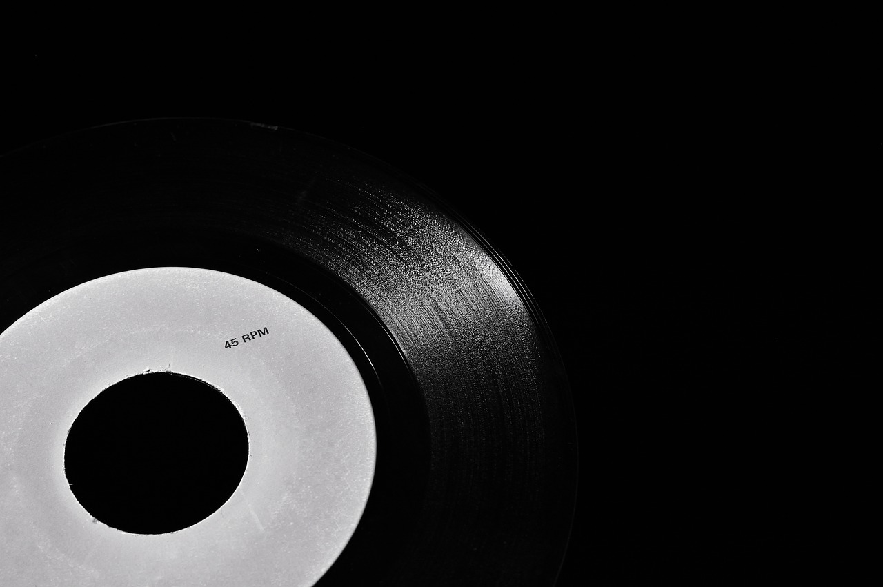 a black and white photo of a vinyl record, a black and white photo, inspired by Jan Rustem, pexels contest winner, miniature product photo, 15081959 21121991 01012000 4k, mapplethorpe, during the night
