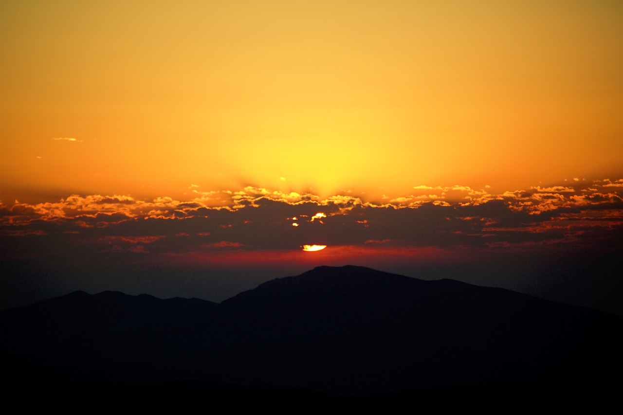 the sun is setting over a mountain range, a picture, by Alexis Grimou, ((sunset)), bright yellow and red sun, taken with my nikon d 3, sunset kanagawa prefecture